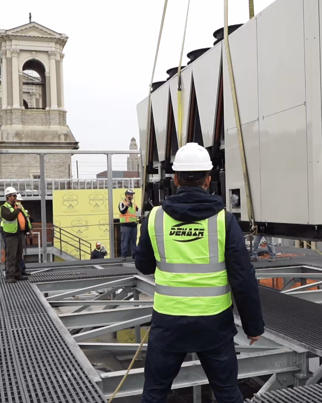 HVAC technician servicing commercial rooftop equipment